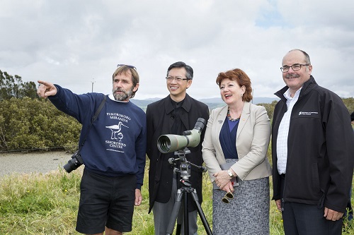 Viewing godwits and red knots at Pukorokoro-Miranda from left Adrian Riegen (Deputy Chair and Convenor of the NZ Wader Studies Group), Chinese Ambassador Wang,  Maggie Barry (Conservation Minister) and Lou Sanson (DOC Director-General)